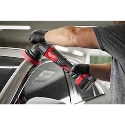 Man using the M18 FUEL 15 mm Random Orbital Polisher on a car
