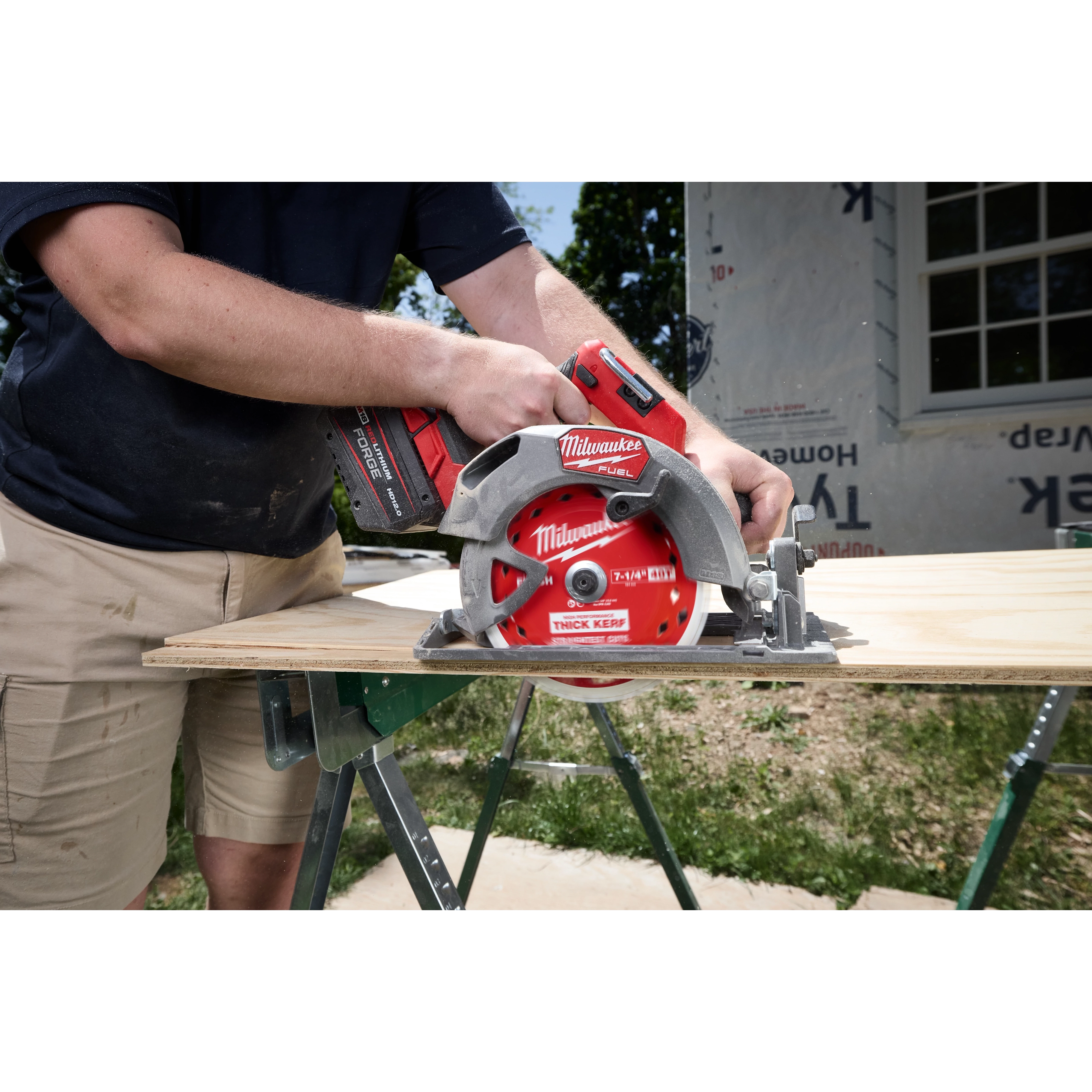 7-1/4" 40T Thick Kerf Finish Circular Saw Blade mounted on a cordless saw cutting plywood on sawhorses.