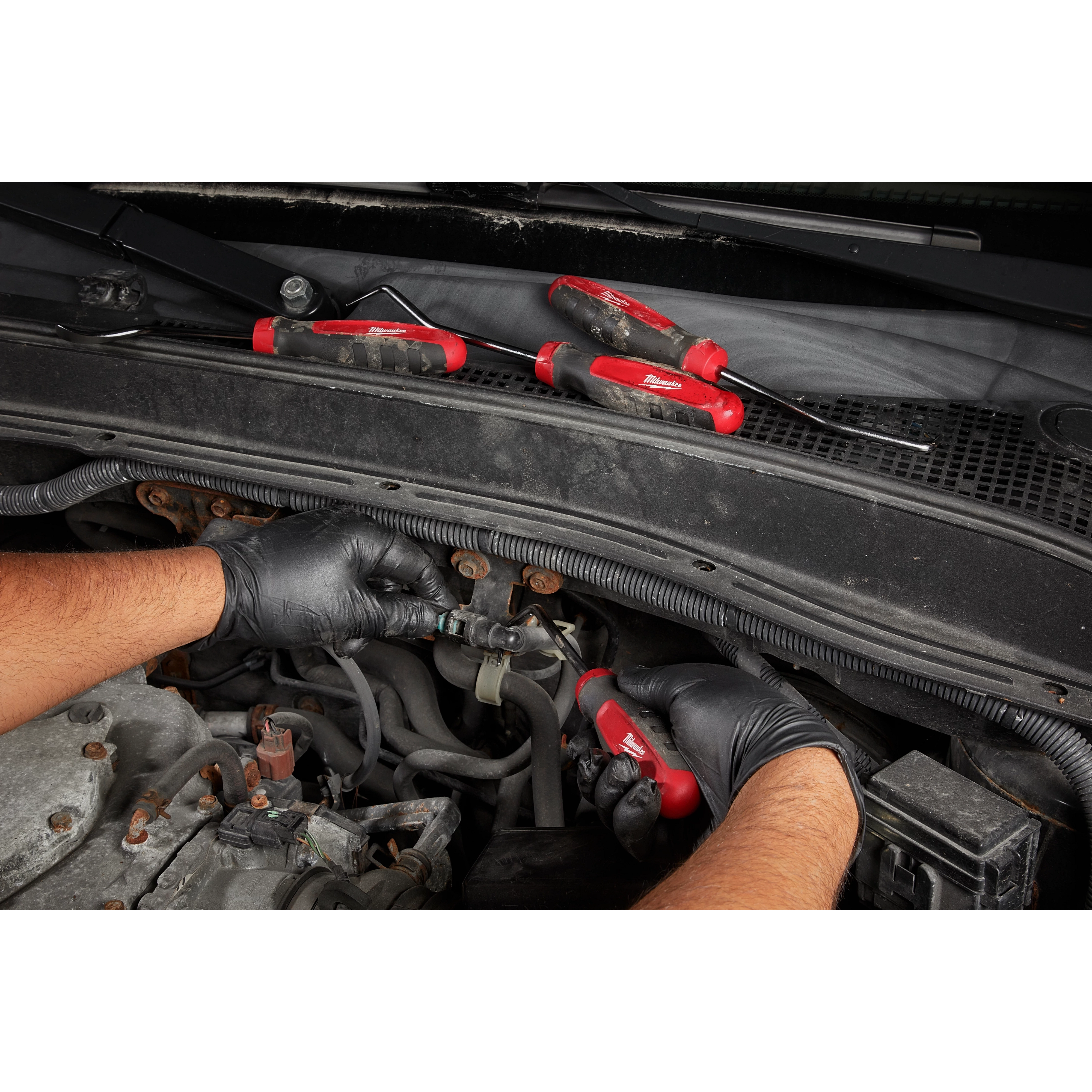 Worker using the Hook and Pick hand tool