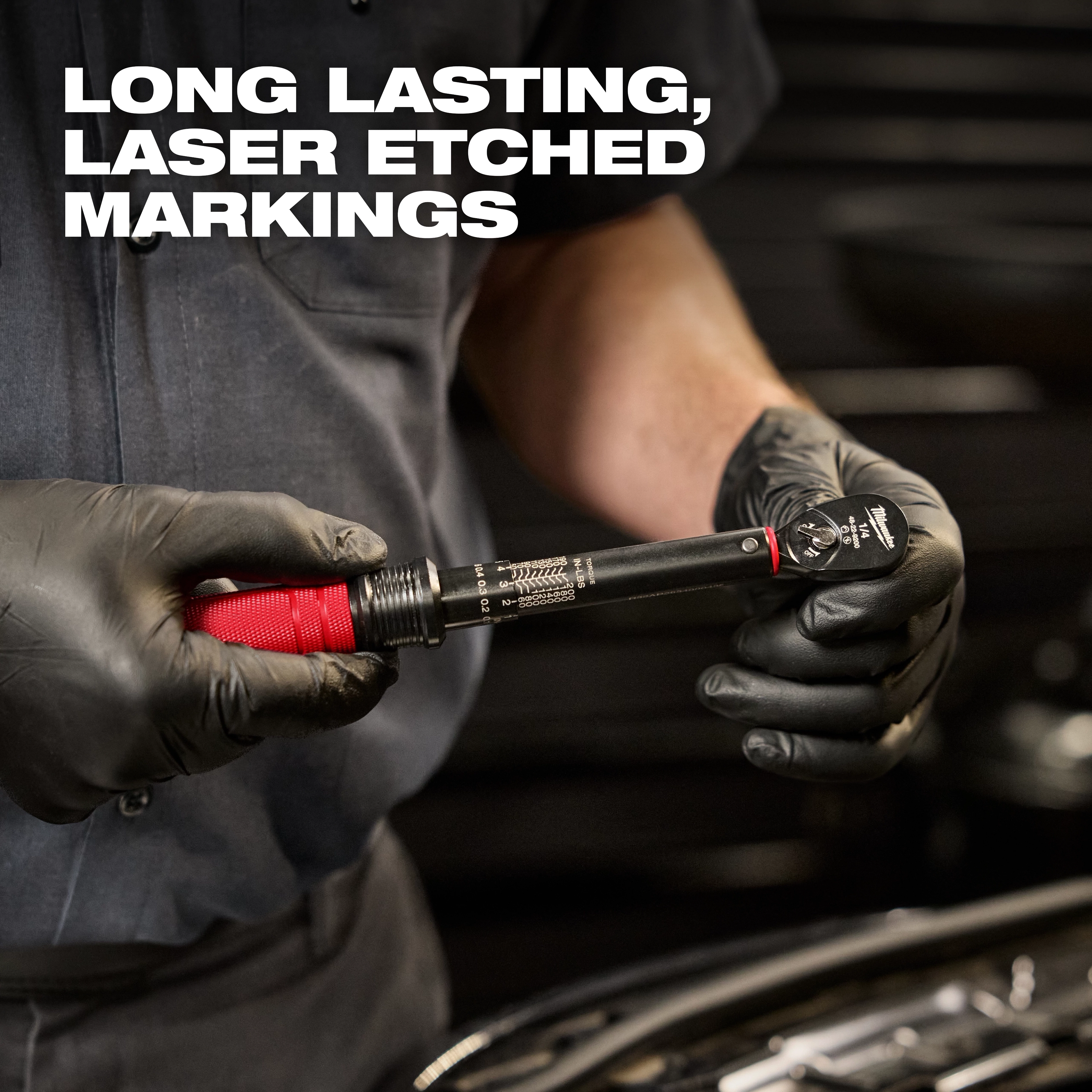 A mechanic wearing black gloves holds a 1/4” Drive Click Torque Wrench (40-200 in·lbf). Text on image reads "Long Lasting, Laser Etched Markings."