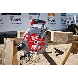 Circular saw featuring a 10-1/4" 40T Thick Kerf Finish Circular Saw Blade resting on wooden beams at a build site.