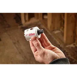 A hand holds a hole saw labeled "Hole Dozer" with a thread adapter attached. The image highlights a 5PK Large Thread Adapters for QUIK-LOK™ Arbor.