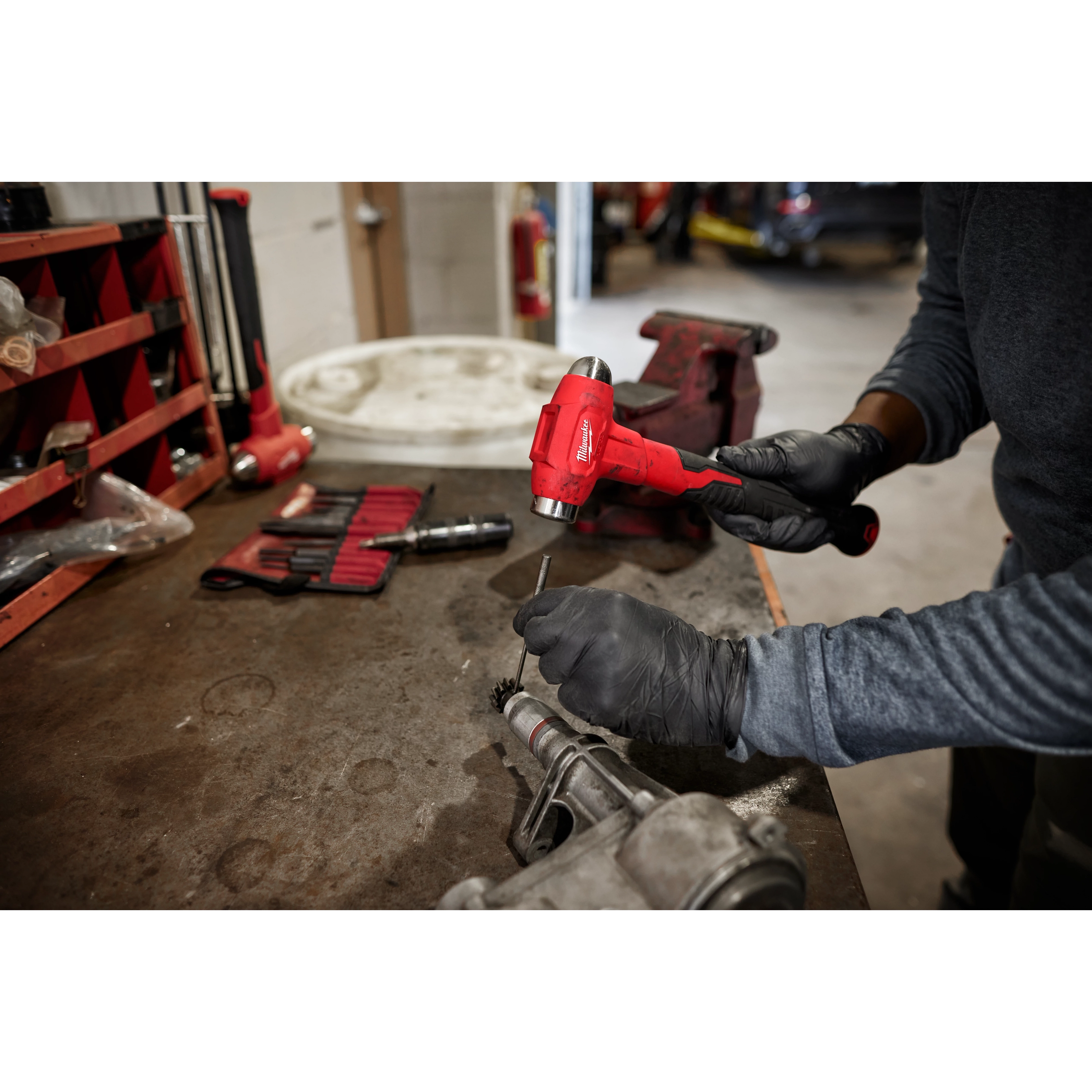 Worker using the 16oz Dead Blow Ball Peen Hammer