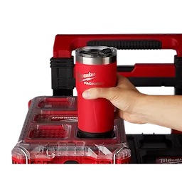 User putting the PACKOUT Tumbler in the PACKOUT cup holder