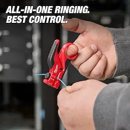 A person uses the Buffer Tube Ringer & Slitter tool to strip the outer coating from a blue wire. The red and black tool is held with one hand while the other hand guides the wire. The background is blurred. Text reads "All-In-One Ringing. Best Control."