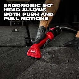 The AIR-TIP Automotive Detail Brush with an ergonomic 90° head is being used to clean a car's carpet in the image.
