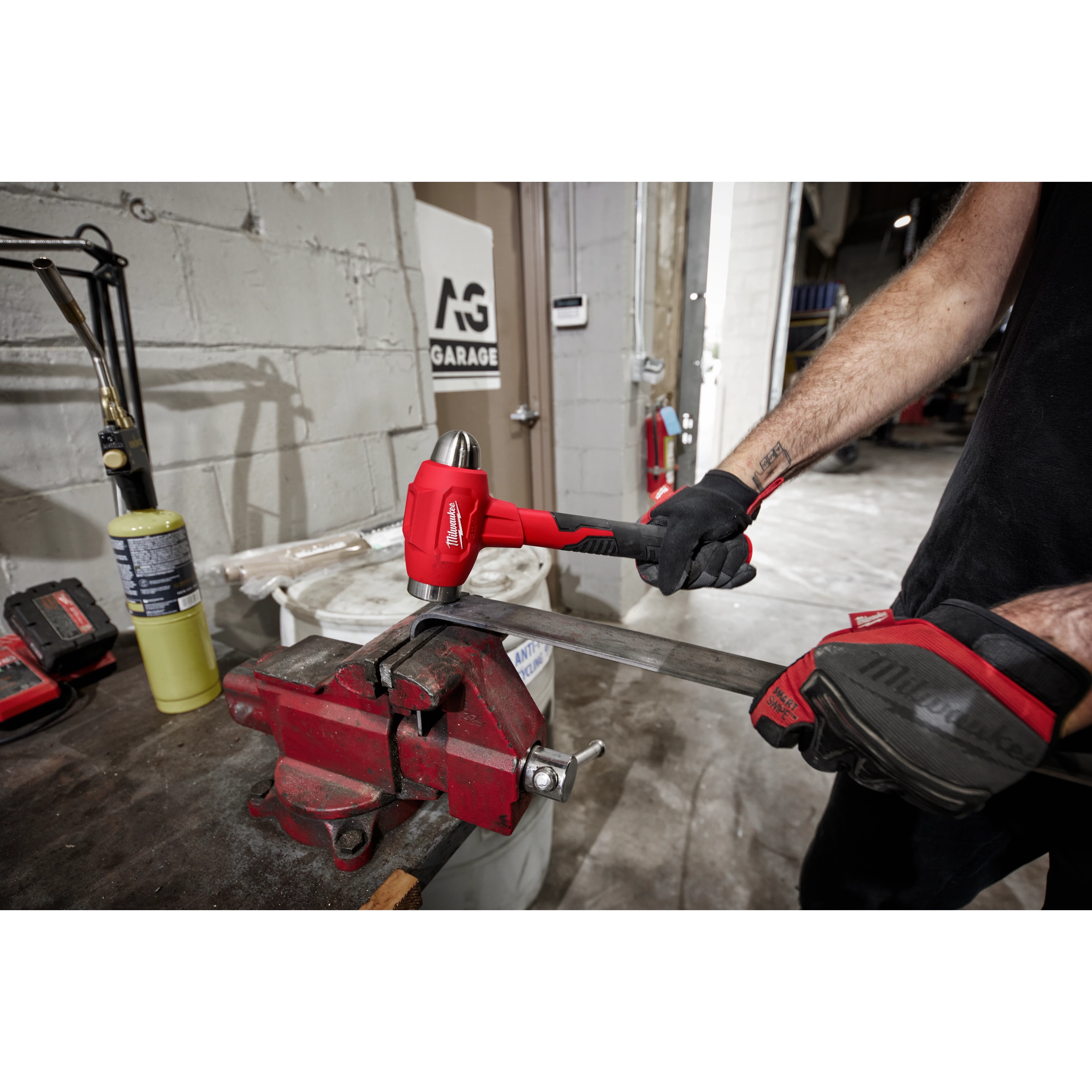 Worker using the 32oz Dead Blow Ball Peen Hammer