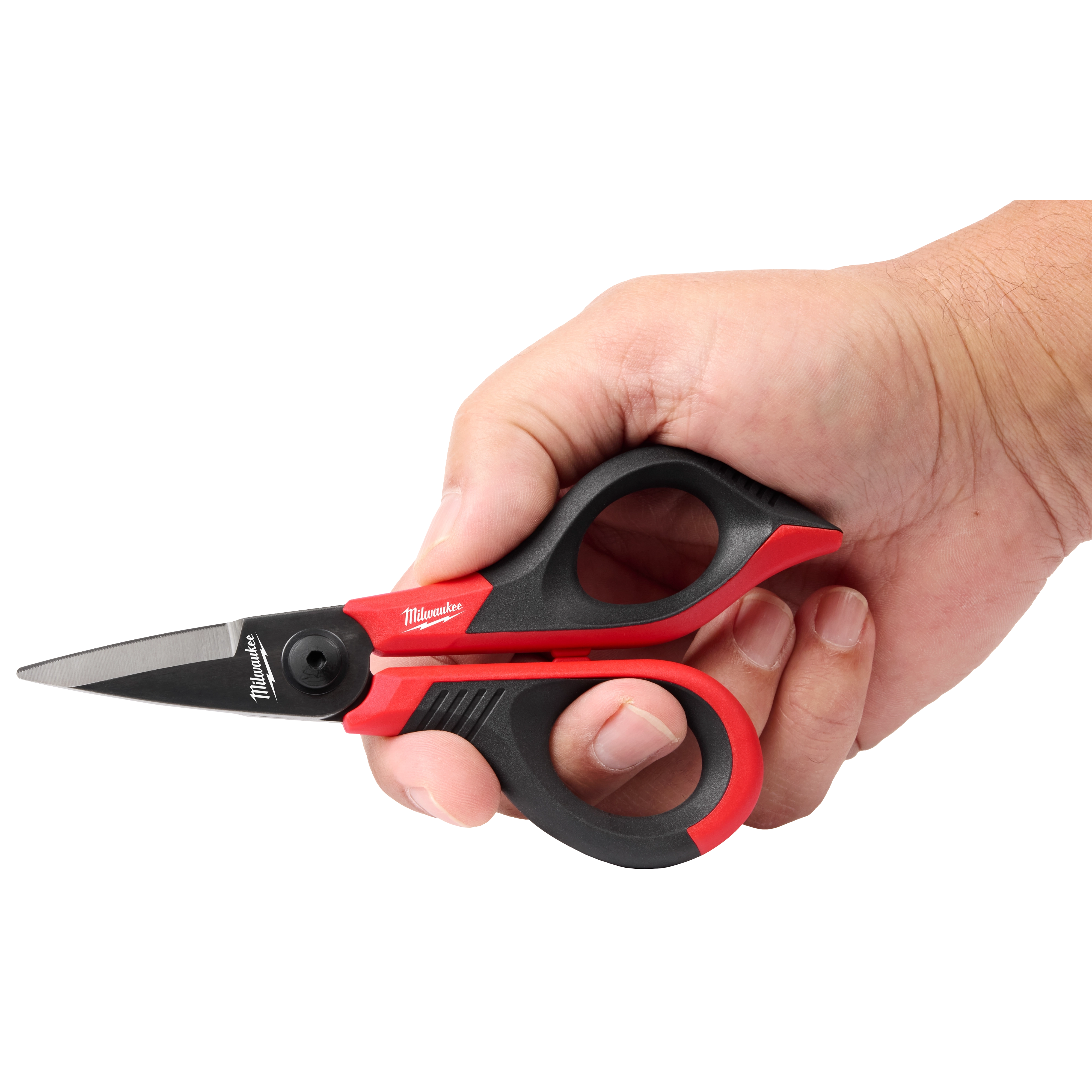 A hand holding red and black precision scissors with a short blade.