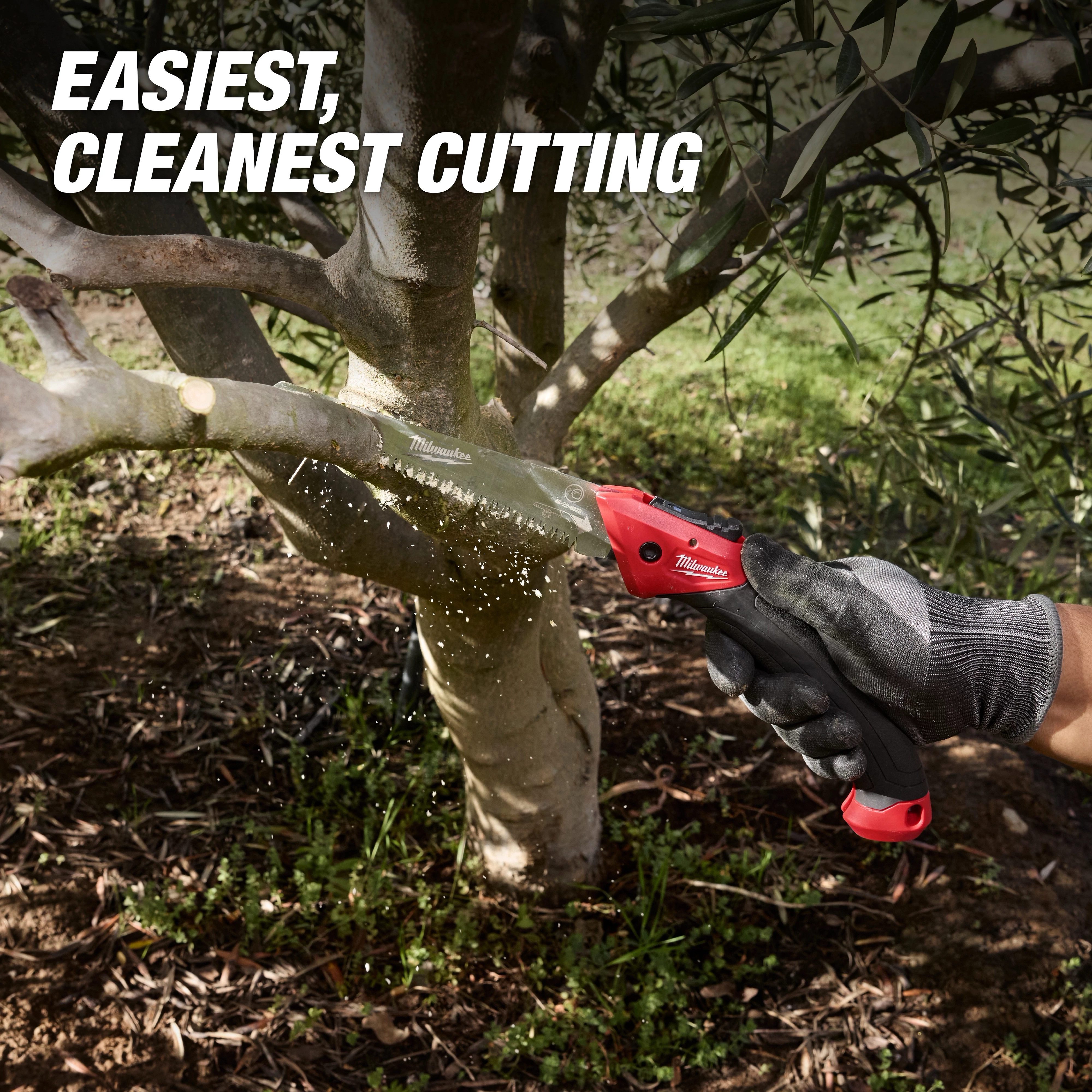7” Folding Pruning Saw – Straight Blade cutting through a tree branch outdoors.