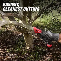 7” Folding Pruning Saw – Straight Blade cutting through a tree branch outdoors.