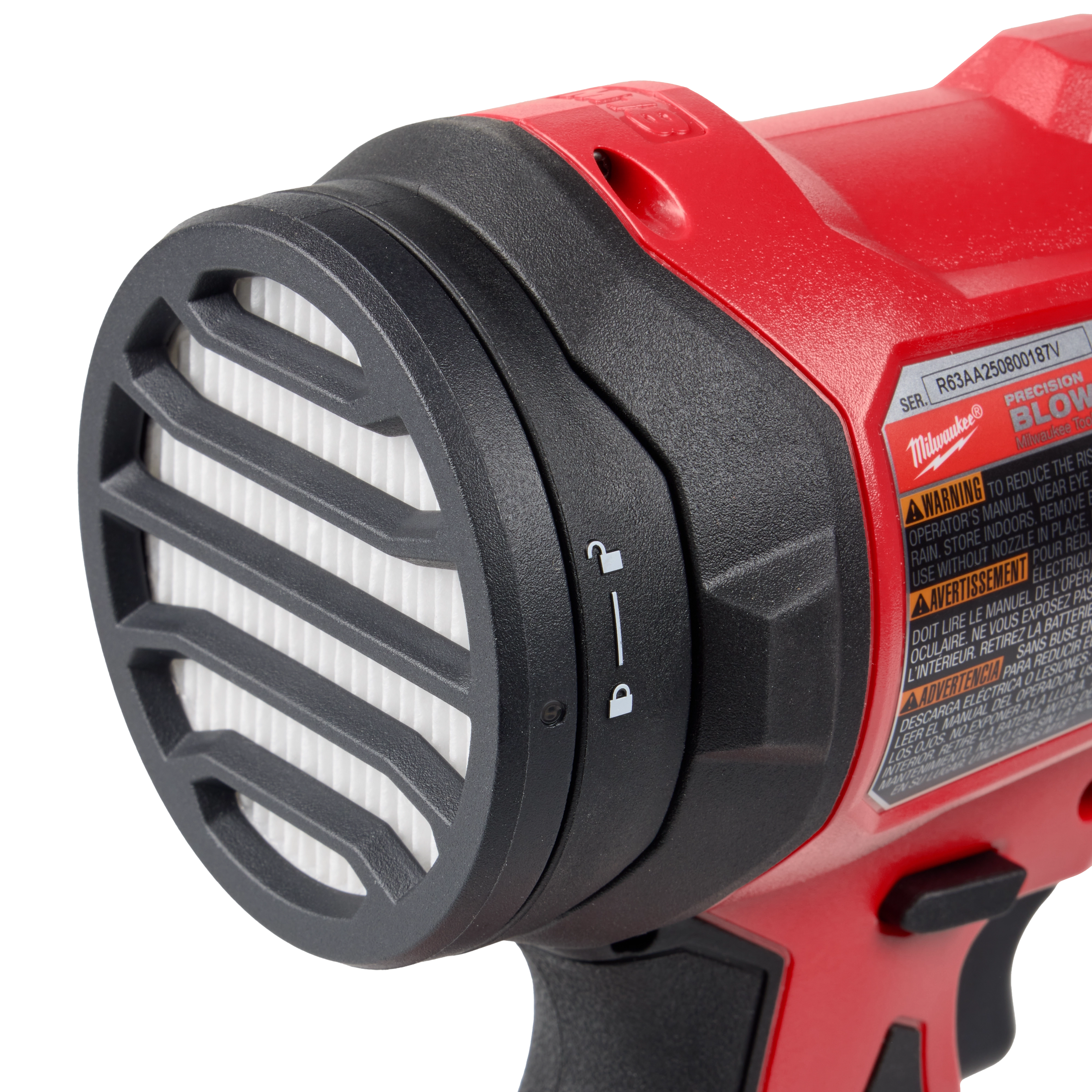 The M18™ Brushless Precision Blower has a red body with a black and white vented nozzle. The blower's handle is shown partially, along with a warning label.