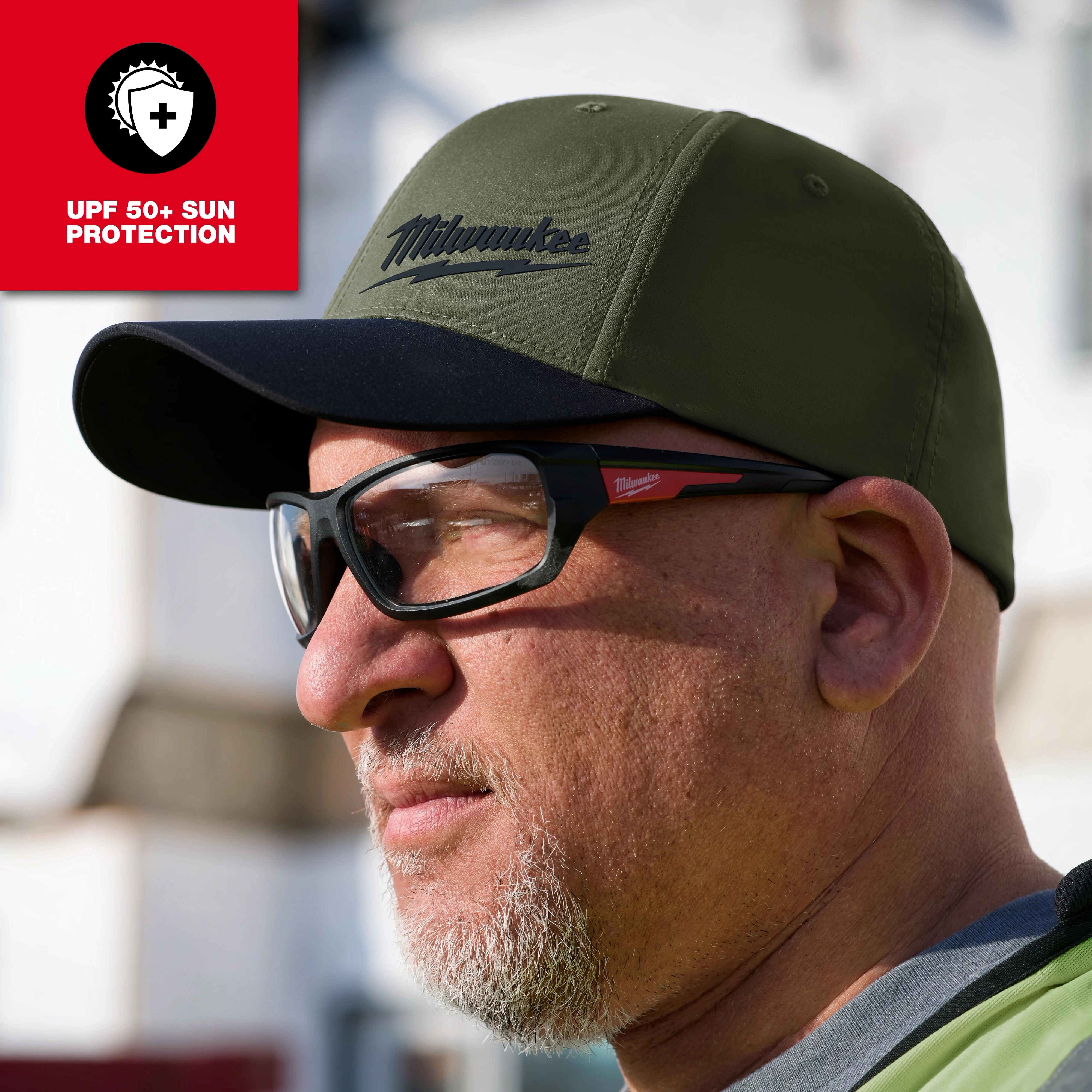 WORKSKIN Performance Fitted Hat in olive green, featuring custom sweat-wicking fabric technology.