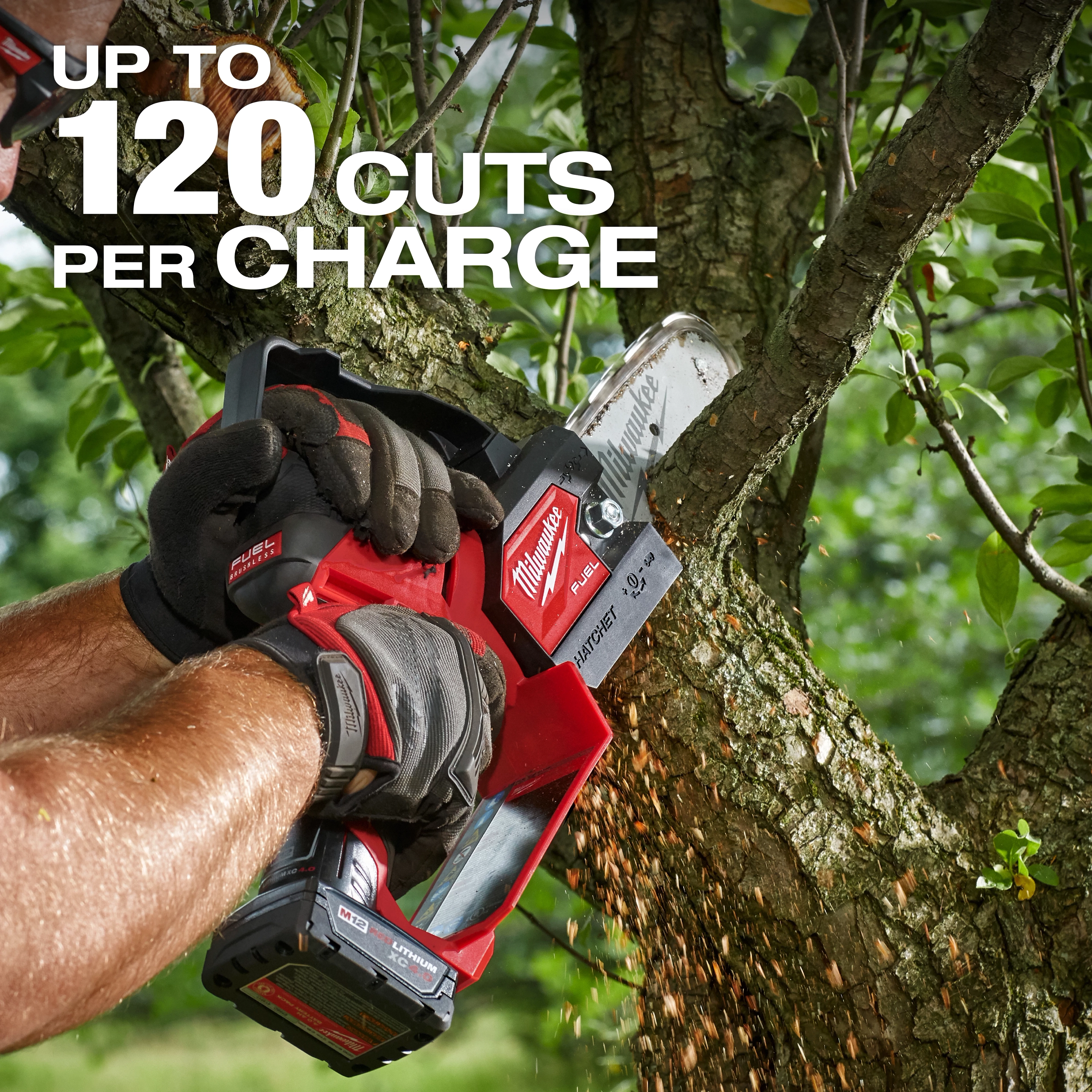 A person using the M12 FUEL™ HATCHET™ 6" Pruning Saw to cut a tree branch. The text on the image states "UP TO 120 CUTS PER CHARGE." The tool is red and black with sawdust visible as the cut is made.