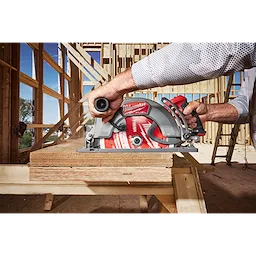 10-1/4" 40T Thick Kerf Finish Circular Saw Blade mounted on a circular saw cutting stacked boards in a framed structure.
