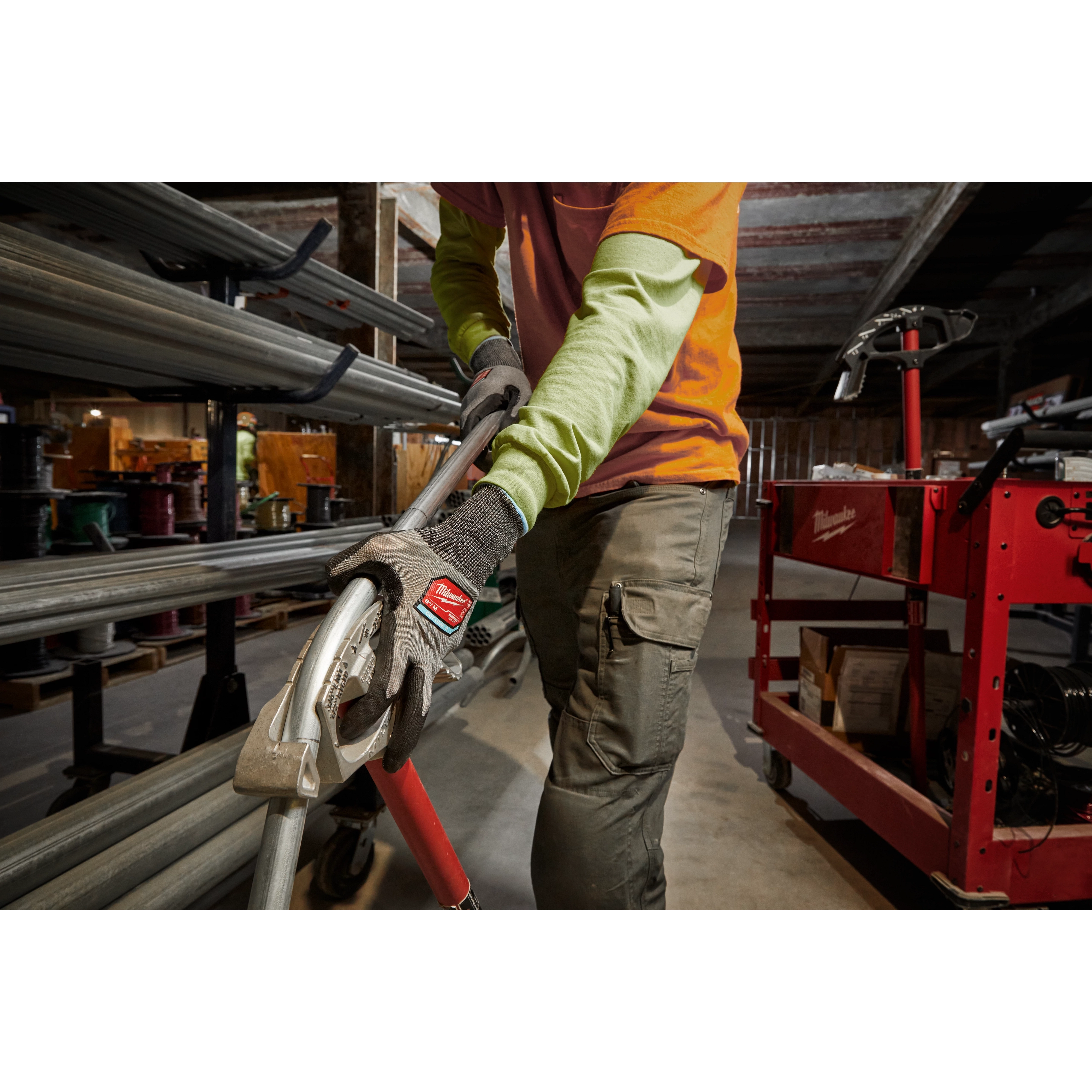 Worker wearing the Cut 2 High-Dexterity Gloves while using a power tool