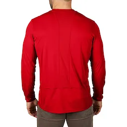 The image displays the back view of a man wearing a red WORKSKIN Lightweight Performance Shirt with long sleeves and grey pants.