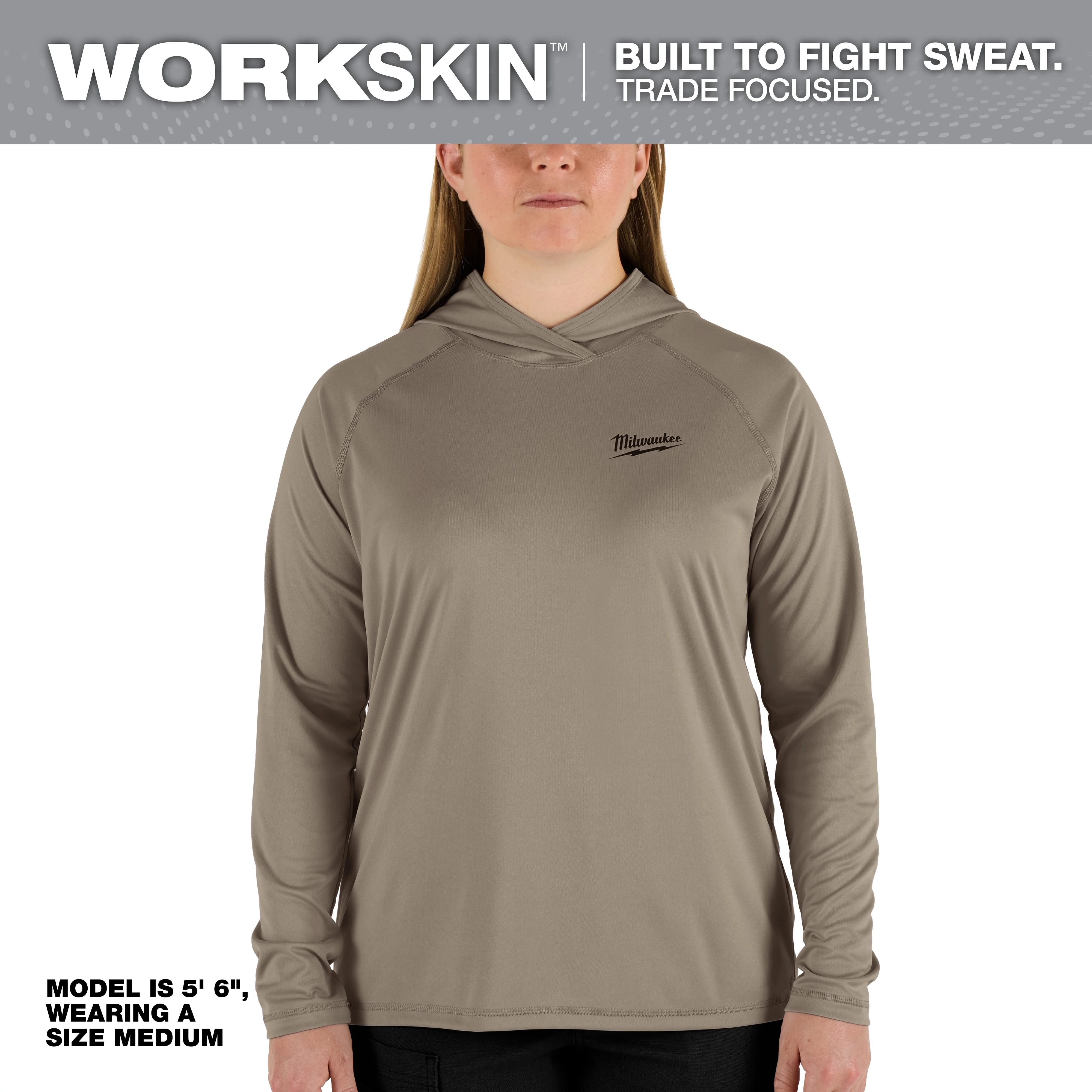 Women's WORKSKIN Hooded Sun Shirt – Sandstone, modeled by a female in size medium, 5'6" height, designed for sweat management and trade focus.