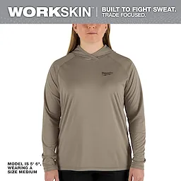 Women's WORKSKIN Hooded Sun Shirt – Sandstone, modeled by a female in size medium, 5'6" height, designed for sweat management and trade focus.