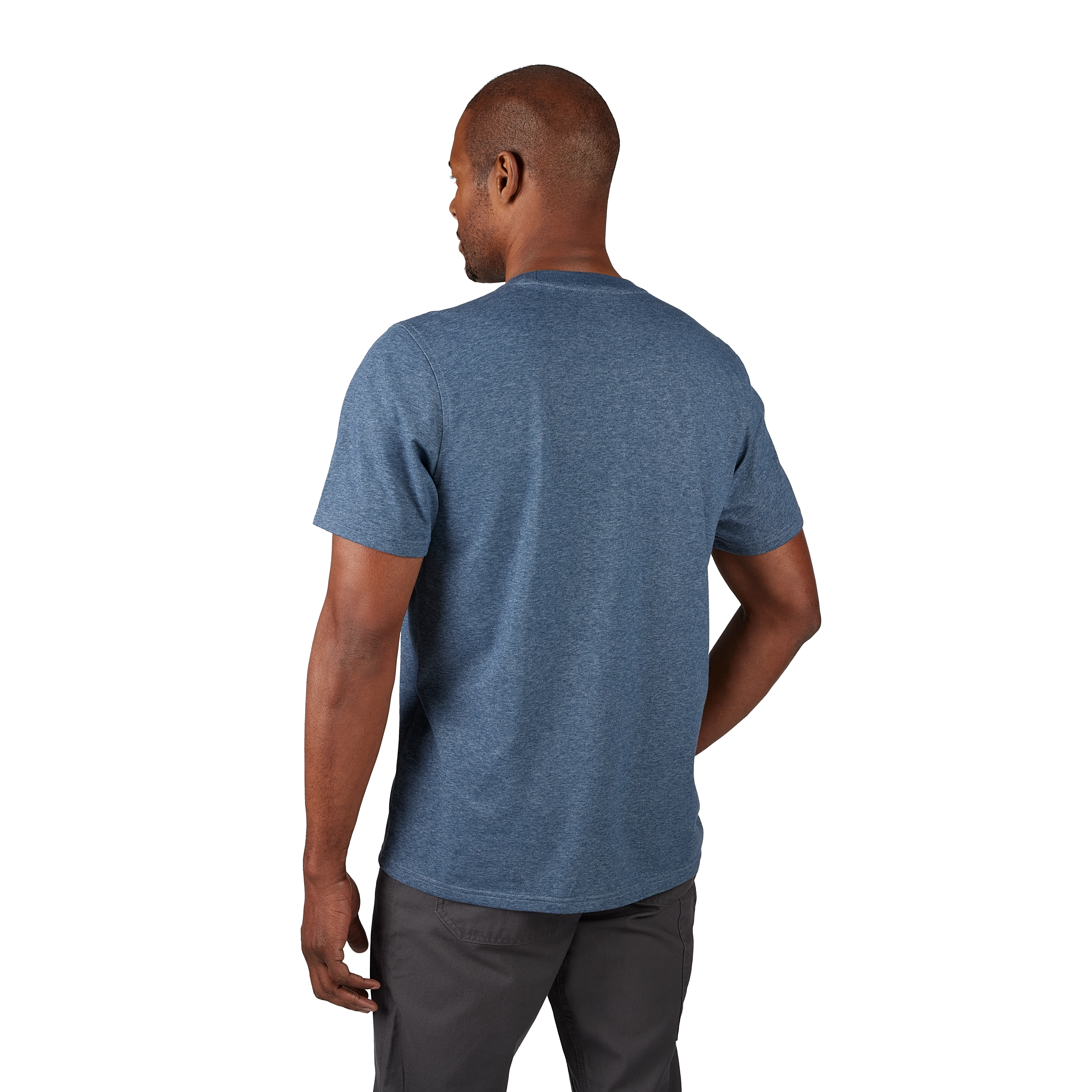Hybrid Work Tee in light blue, shown from behind, worn by a man standing with his arm slightly bent, wearing dark grey pants.