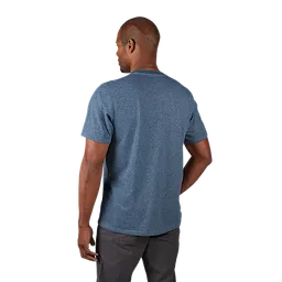 Hybrid Work Tee in light blue, shown from behind, worn by a man standing with his arm slightly bent, wearing dark grey pants.