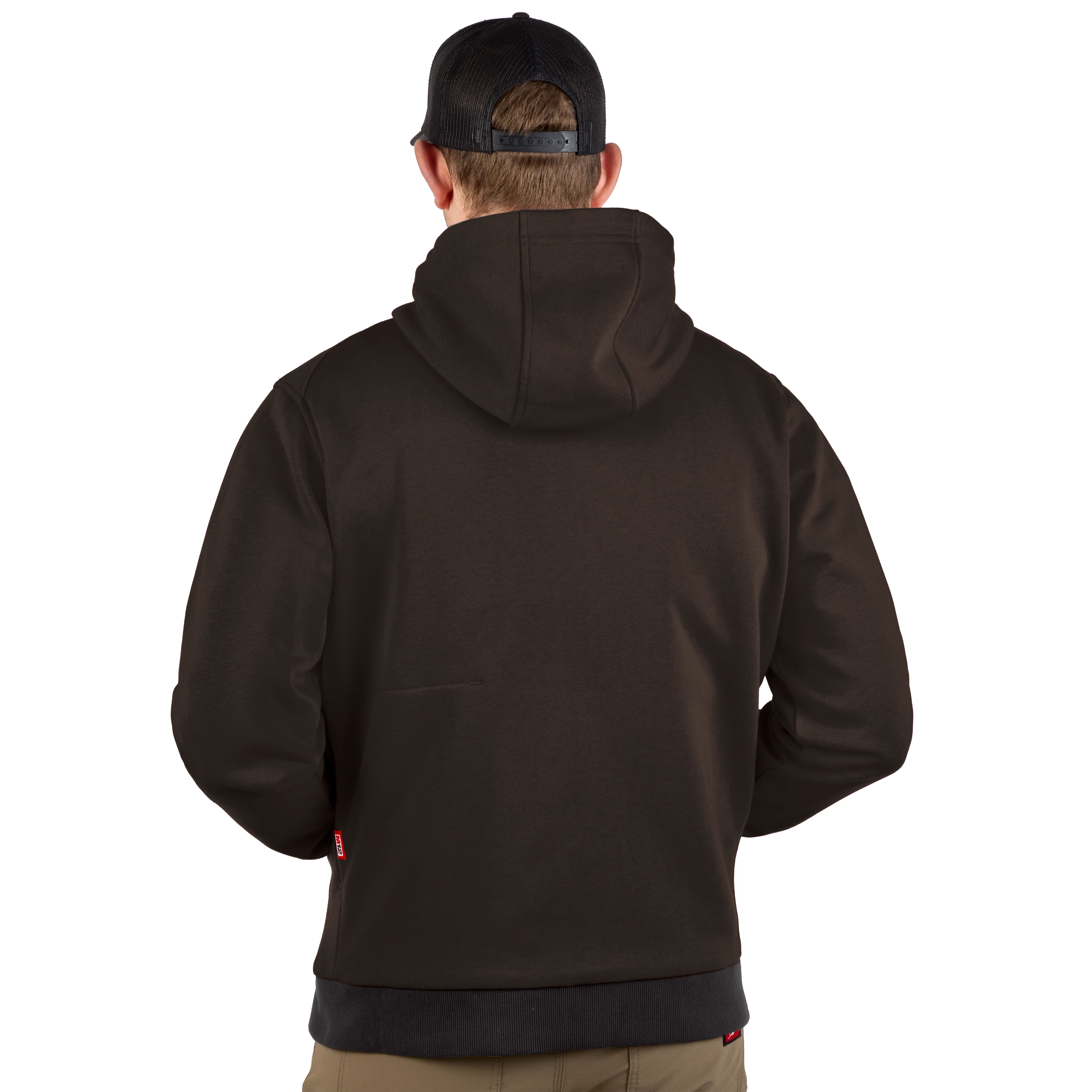 The image shows a person wearing a black M12™ Heated Hoodie viewed from the back. The hoodie fits snugly, with a hood covering the head, and the individual is wearing a black cap.