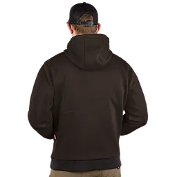 The image shows a person wearing a black M12™ Heated Hoodie viewed from the back. The hoodie fits snugly, with a hood covering the head, and the individual is wearing a black cap.