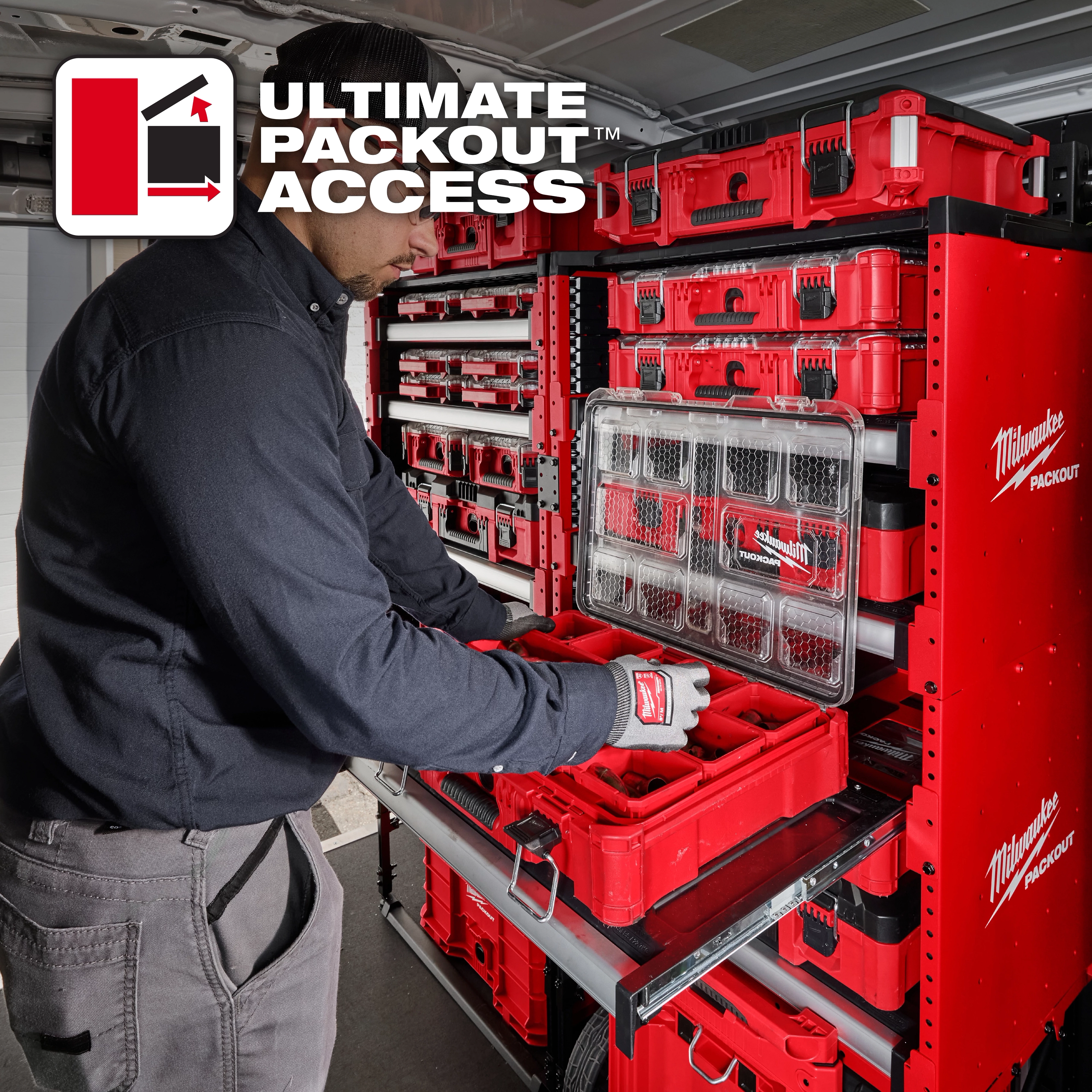 A person organizes tools into a Milwaukee PACKOUT™ Rack system in a vehicle. The red and black PACKOUT™ containers are securely stacked and arranged for easy access. The text "ULTIMATE PACKOUT ACCESS" is displayed in the corner.