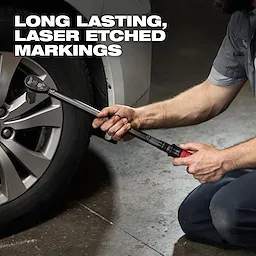 A person uses the 1/2" Drive Click Torque Wrench (50-250 ft·lbf) to tighten lug nuts on a car wheel, emphasizing its laser-etched markings.