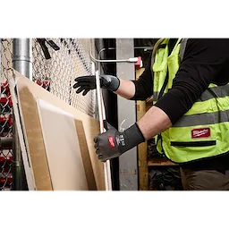 Worker wearing Cut Level 3 High Dexterity Nitrile Dipped Gloves w/ WEAR-DEFENSE Protection handling boards.
