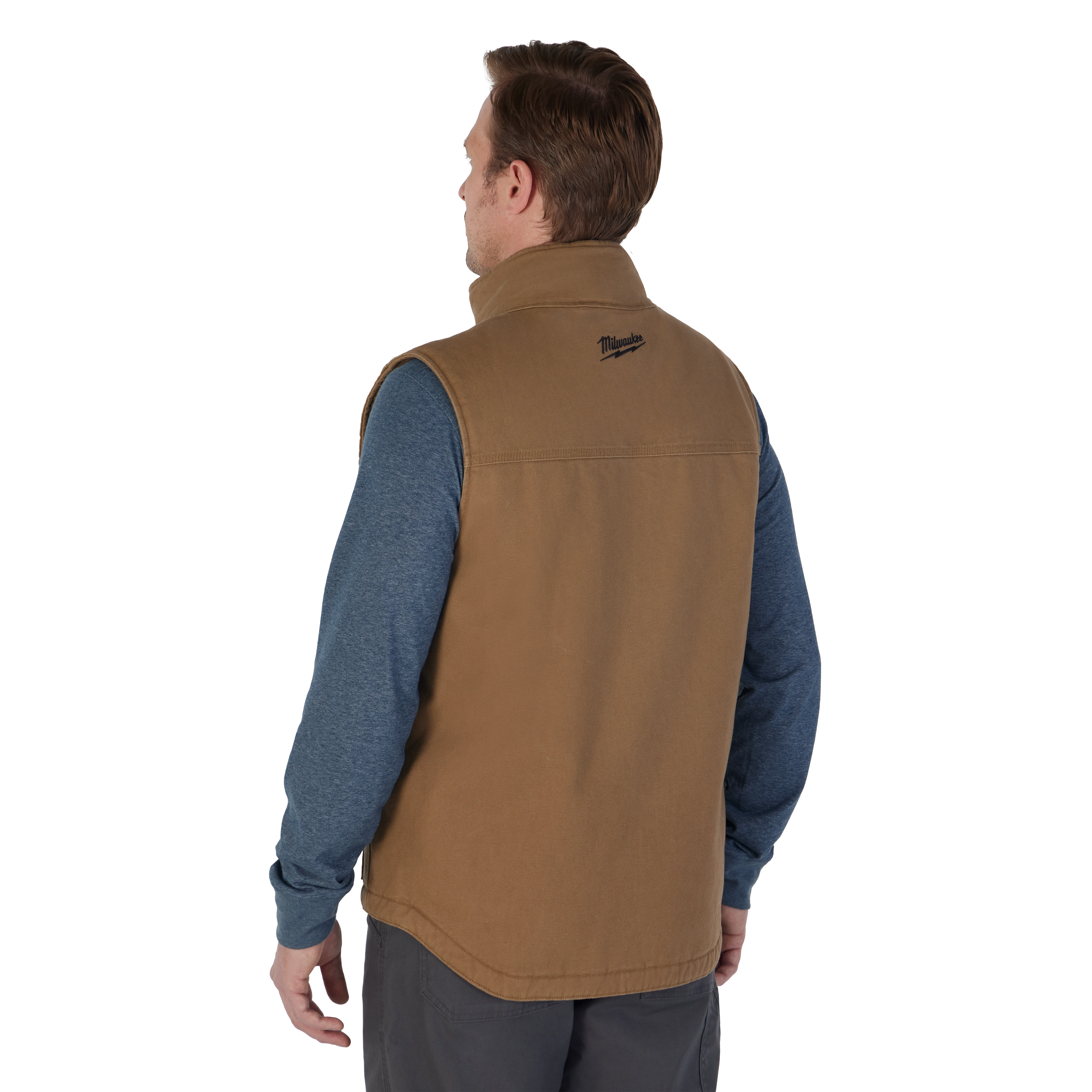 Man wearing the brown heavy duty sherpa-lined vest over the blue pullover hoodie
