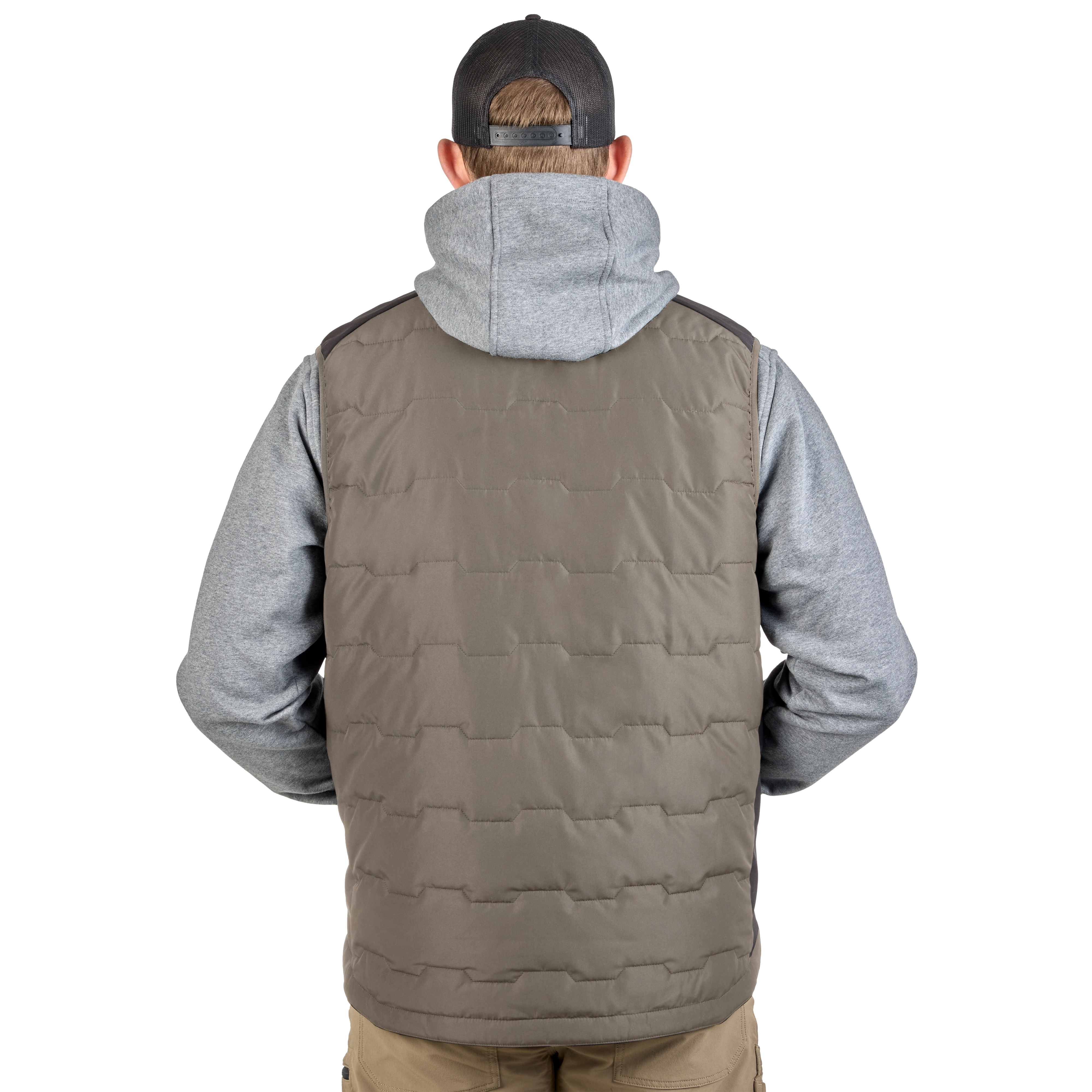 A person wearing a gray hoodie and beige pants displays the back of the FREEFLEX™ Lightweight Insulated Vest in brown. The vest has a quilted pattern and a high collar.