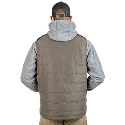A person wearing a gray hoodie and beige pants displays the back of the FREEFLEX™ Lightweight Insulated Vest in brown. The vest has a quilted pattern and a high collar.