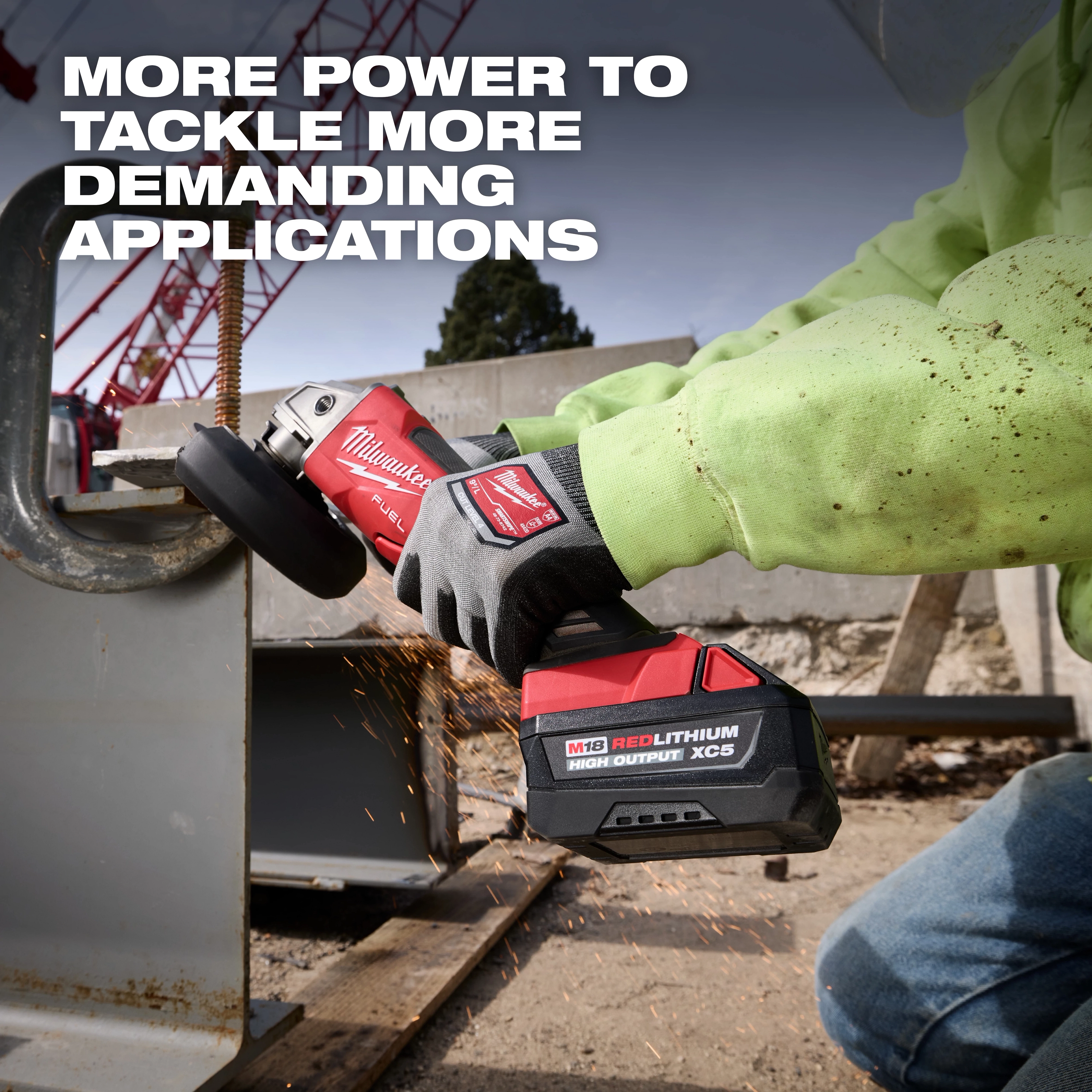 Worker grinds metal with a power tool using an M18 REDLITHIUM HIGH OUTPUT XC5 Battery Pack.