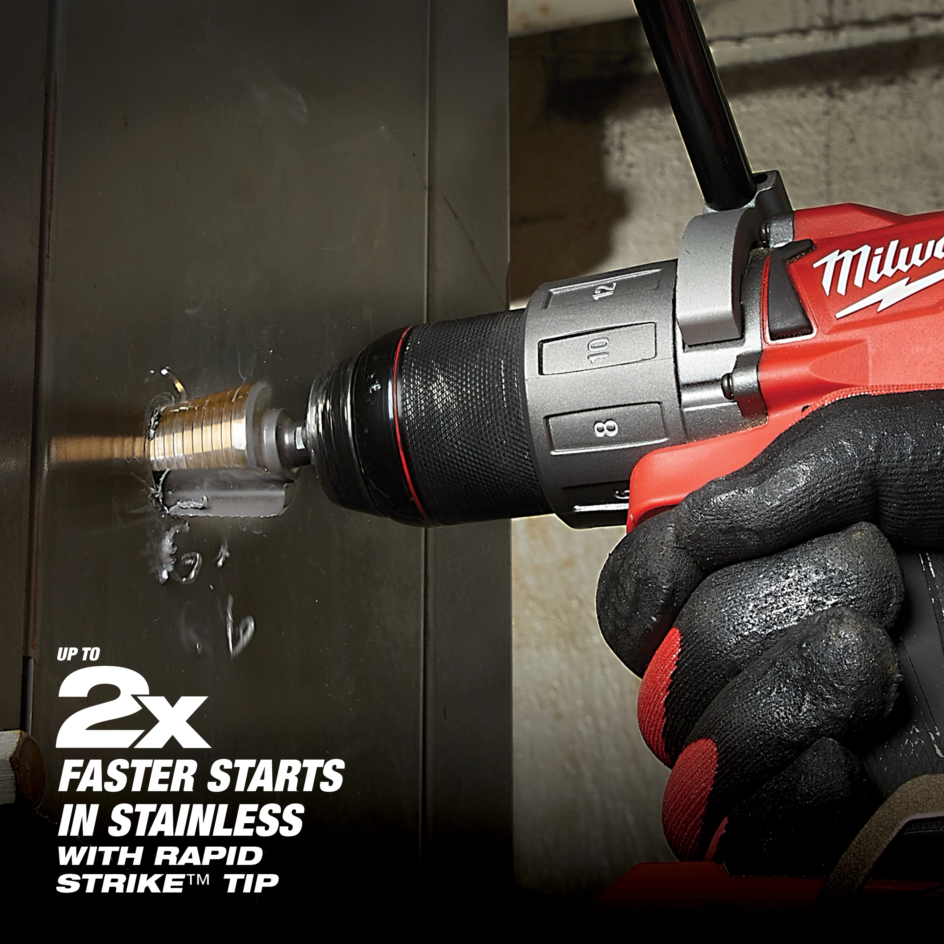 A gloved hand uses a red power drill with a Cobalt Step Bit, drilling into a stainless steel surface. Text on the image highlights "Up to 2x Faster Starts in Stainless with Rapid Strike™ Tip." The bit appears to be working efficiently, creating a smooth and clean hole.