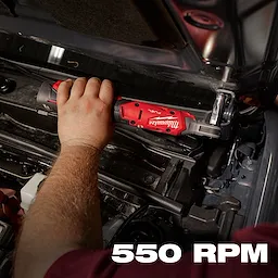 A person is using an M12 FUEL™ 1/4" Ratchet to work on a car engine. The tool is red and black with branding visible. The text "550 RPM" is displayed in white at the bottom right of the image.
