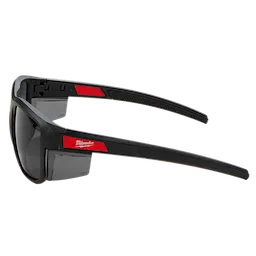 Full Frame Safety Glasses with Removable Side Shields feature tinted anti-scratch lenses. The glasses have a robust black frame with red accents and removable side shields for additional protection. Brand logo is visible on the temples. Designed for high durability and protection in various environments.