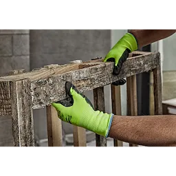 Hi Vis Cut Gloves being worn by a person handling a rough wooden pallet. The gloves are bright green with black reinforced fingertips.