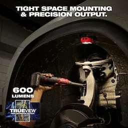 Milwaukee Rechargeable Pivoting Task Light w/ Spot Mode mounted inside a wheel well illuminating suspension parts.
