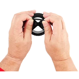 Two hands holding the PACKOUT™ Sip Lid, a black circular plastic lid designed for beverages. The lid has a central opening with a sip hole.