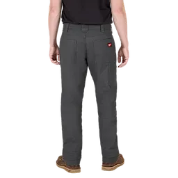 A person is seen from the back wearing dark gray utility pants with multiple pockets and a small red tag on the right pocket. The person is also wearing a black shirt and brown shoes.