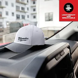 WORKSKIN Performance Fitted Hat - Gray, featuring the product logo, rests on a car dashboard with a "Lightweight and Breathable" icon.