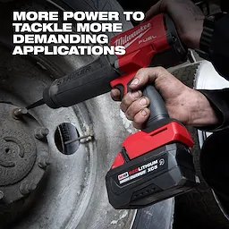 Hand using power tool with M18 REDLITHIUM HIGH OUTPUT XC5 Resistant Battery Pack on a vehicle wheel.