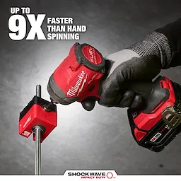 The SHOCKWAVE™ Impact Duty 3/8" Threaded Rod Nut Runner is shown in use with a Milwaukee power tool on a threaded rod. The image highlights the product's efficiency with text claiming it is "Up to 9X faster than hand spinning." Gloved hands operate the tool.