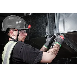 Worker wearing Cut Level 6 High-Dexterity Nitrile Dipped Gloves - L while using pliers on a metallic structure.