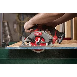 5-3/8" 16T Framing Circular Saw Blade mounted on a handheld saw cutting through a wooden board.