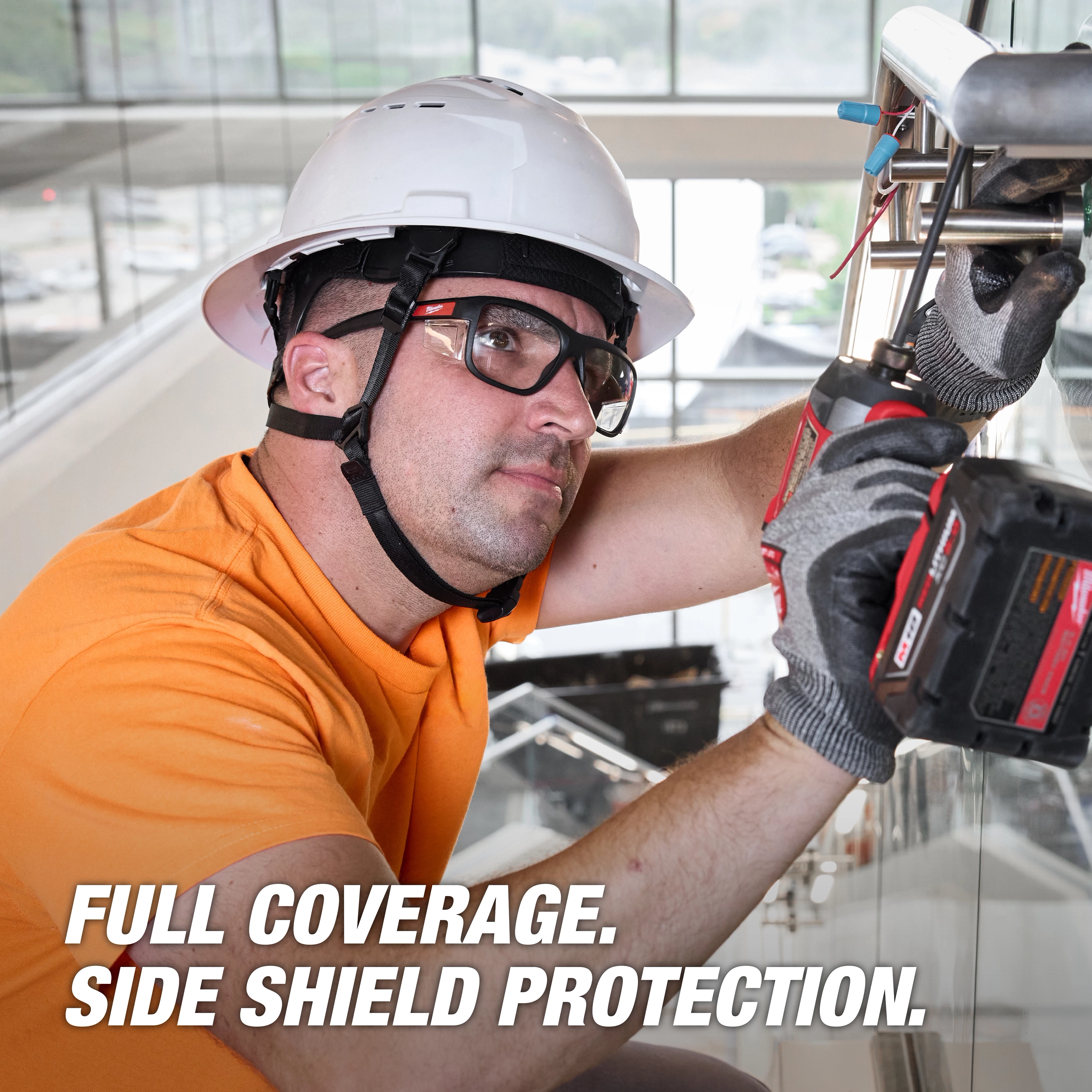 Worker wearing Full Frame Safety Glasses with Removable Side Shields – Clear Anti-Scratch Lenses, using a power tool.