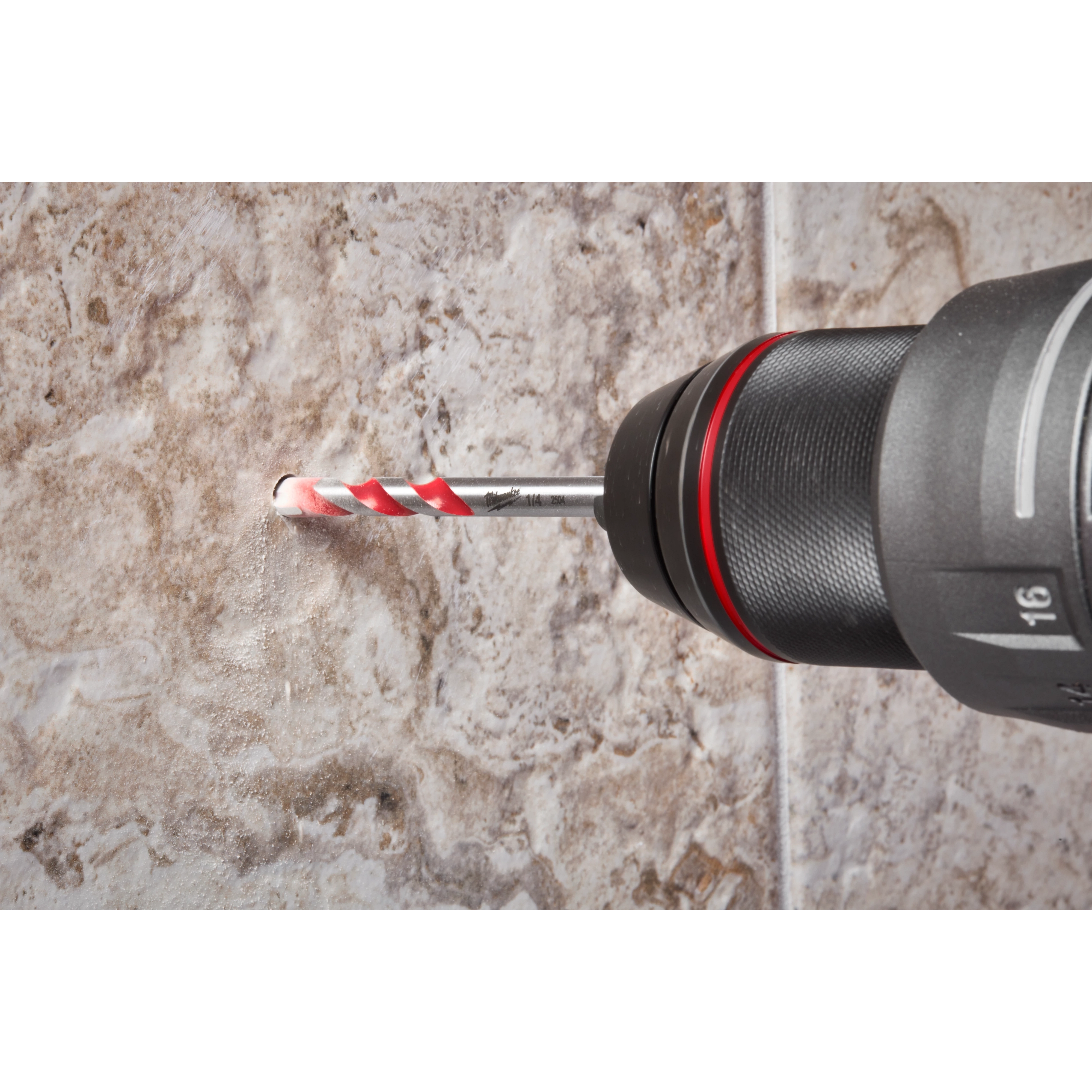 A 1/4" Hard Tile and Glass Bit is being used in a drill to create a hole in a beige, marble-like tile surface. The bit features a red and white spiral design for effective drilling in hard tiles and glass materials. Dust is visible around the drilled hole.
