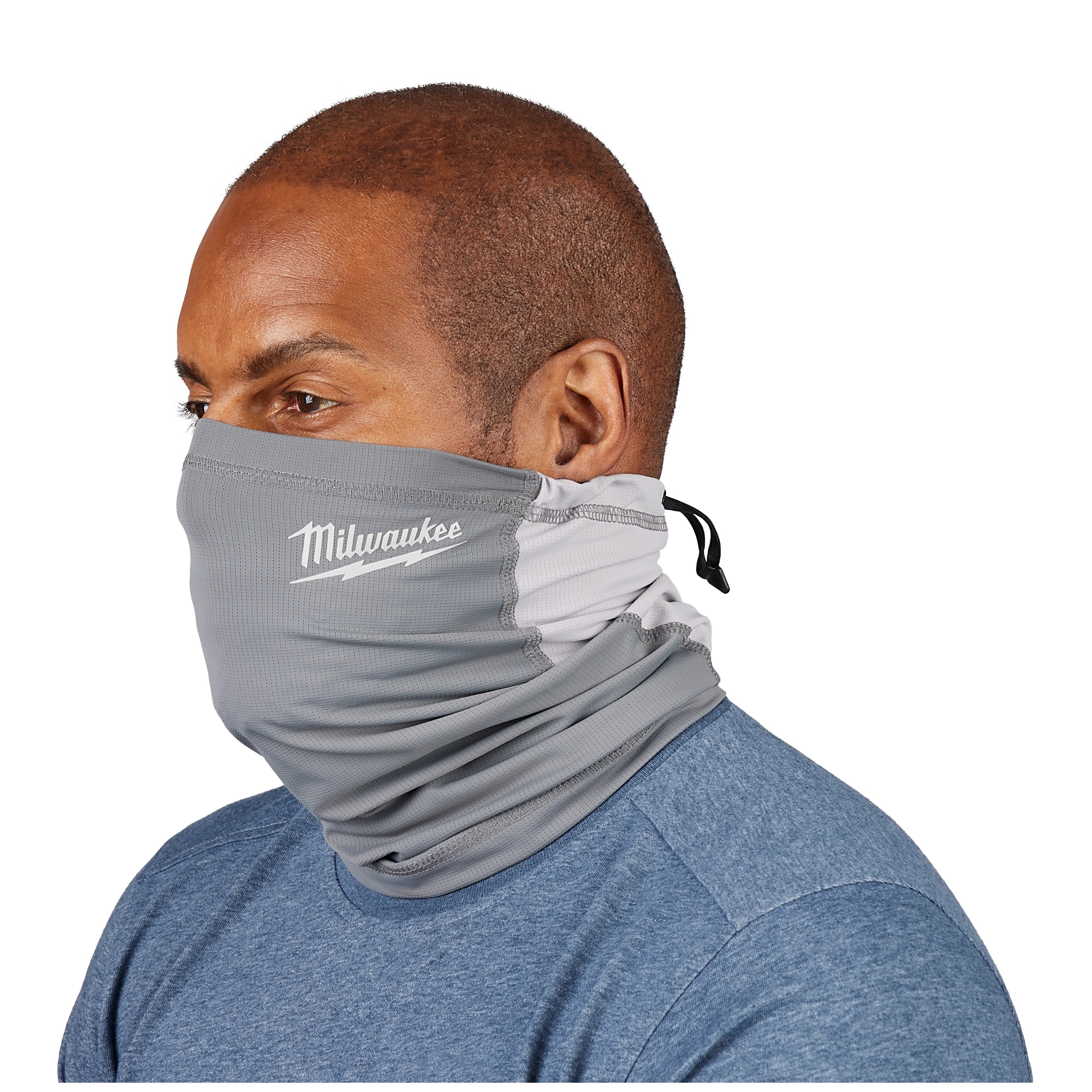 Man wearing the WORKSKIN Performance Neck Gaiter in light gray over a blue shirt. The gaiter covers his neck and part of his face.
