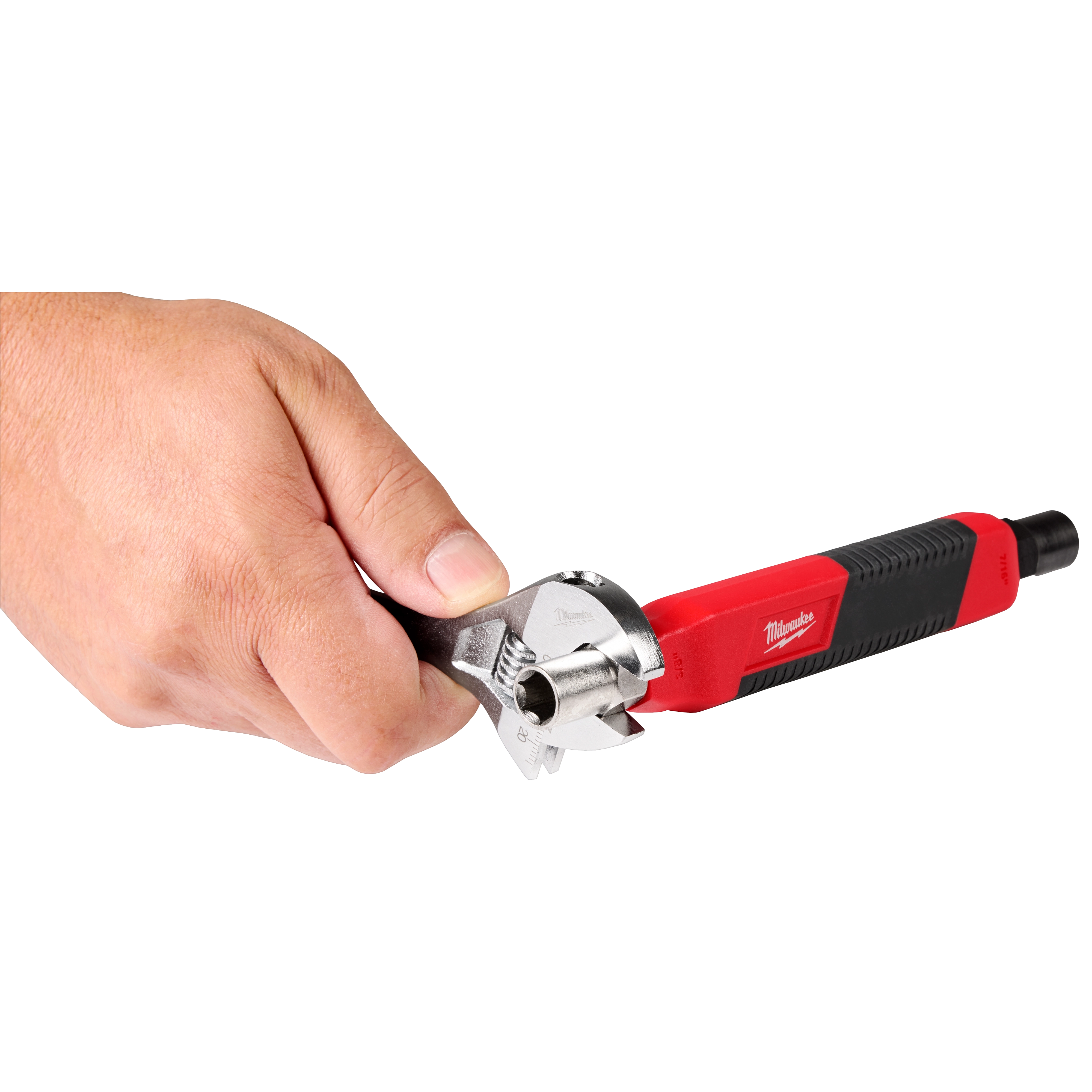 Hand holding a red and black adjustable wrench with a silver head.