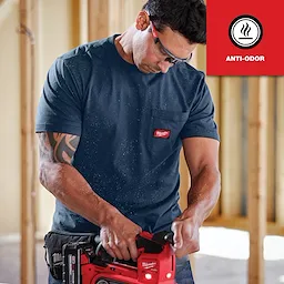 Man wearing GRIDIRON Pocket T-Shirt - Short Sleeve Anti-odor while operating a power tool in a construction setting.